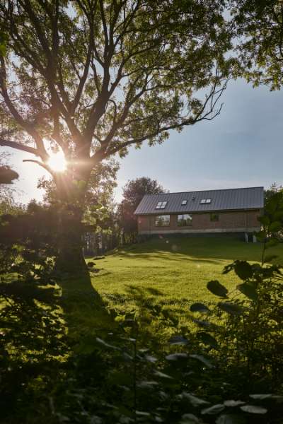 Summer light settles over steel profiles in the forest, Klæstruplundvej 11, 9240 Nibe, Denmark